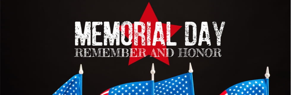 Memorial Day graphic featuring the text "MEMORIAL DAY REMEMBER AND HONOR" with a red star backdrop and American flags in the foreground, symbolizing appreciation for sacrifices made by service members.